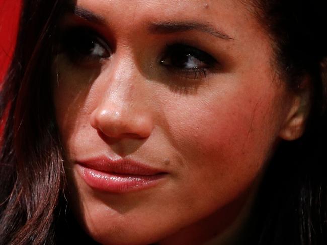 (FILES) In this file photo taken on December 01, 2017 Britain's Prince Harry's fiancee US actress Meghan Markle gestures as they tour the Terrence Higgins Trust World AIDS Day charity fair at Nottingham Contemporary in Nottingham, central England, on December 1, 2017. - Meghan Markle has revealed she suffered a miscarriage in July this year, writing in the New York Times on November 25, 2020 of the deep grief and loss she endured with her husband Prince Harry. (Photo by Adrian DENNIS / various sources / AFP)