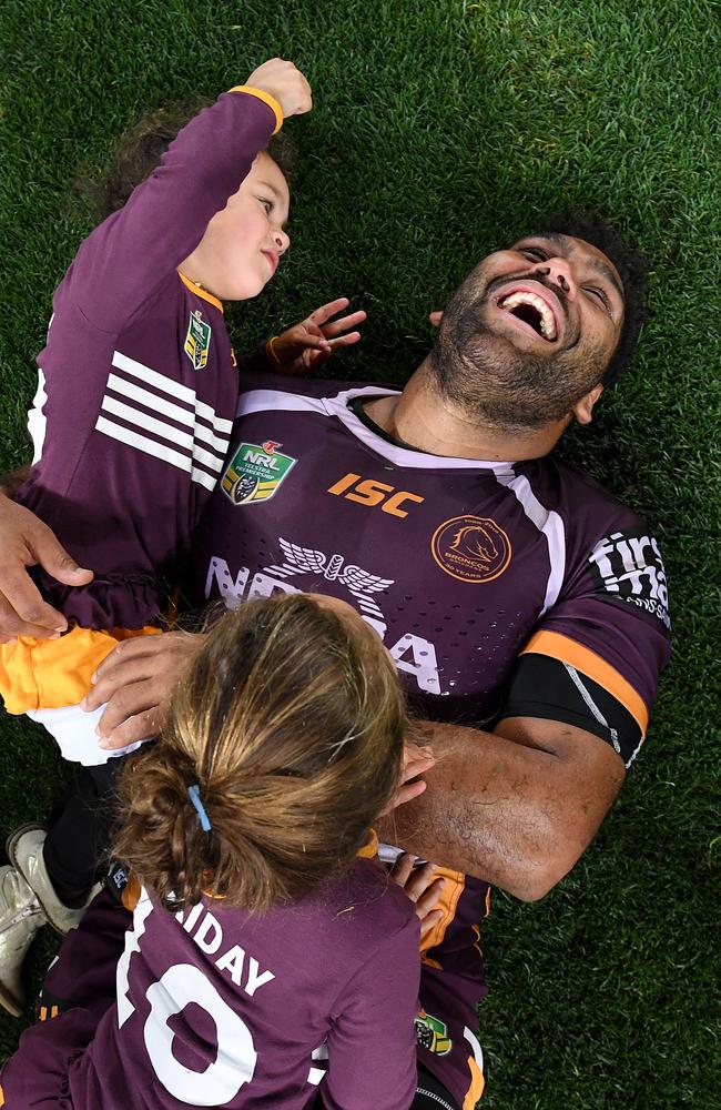 Thaiday with daughters Gracie and Ellsie following the loss to the Dragons. (AAP Image/Dave Hunt)