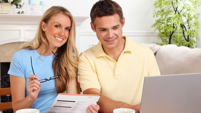 A couple assess competing home loan offers. Picture: iStock.