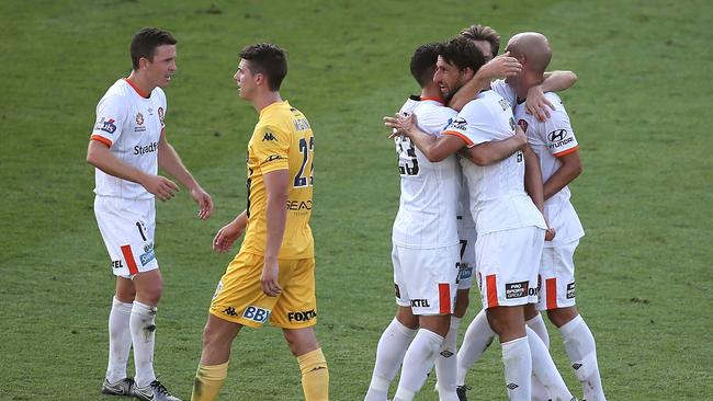 Brisbane Roar players celebrate Dimitri Petratos’ goal at Central Coast Stadium.