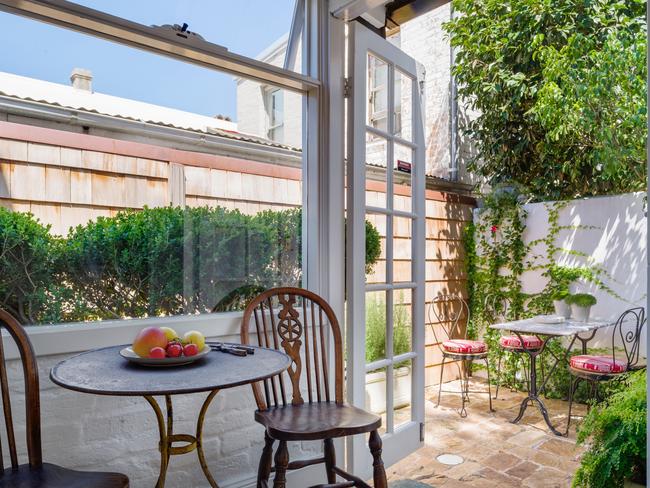 The sunny terrace offers a lovely spot to sit.