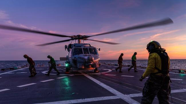 HMAS Hobart has deployed with a MH-60R Romeo Seahawk (pictured) on board.