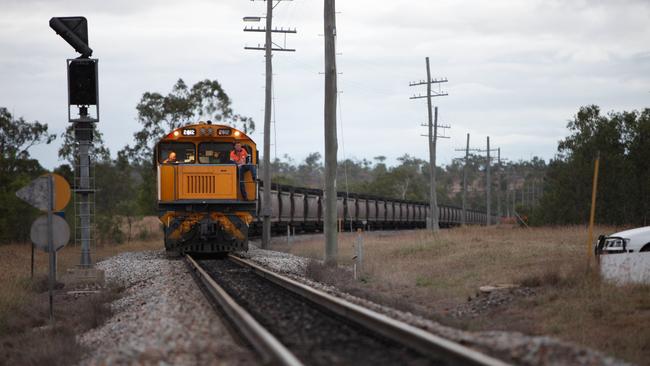 Coal trains travel through the centre of Collinsville. Picture: Cameron Laird