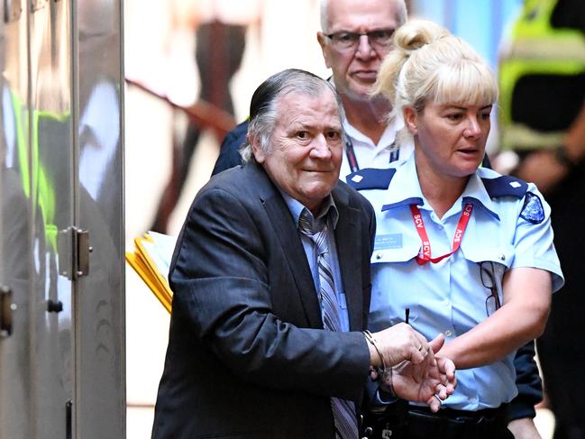 Gregory Keith Davies is escorted into court by prison guards for sentencing at the Supreme Courts in Melbourne. Davies pleaded guilty to the 1984 rape and murder of six-year old Kylie Maybury. Picture: Joe Castro