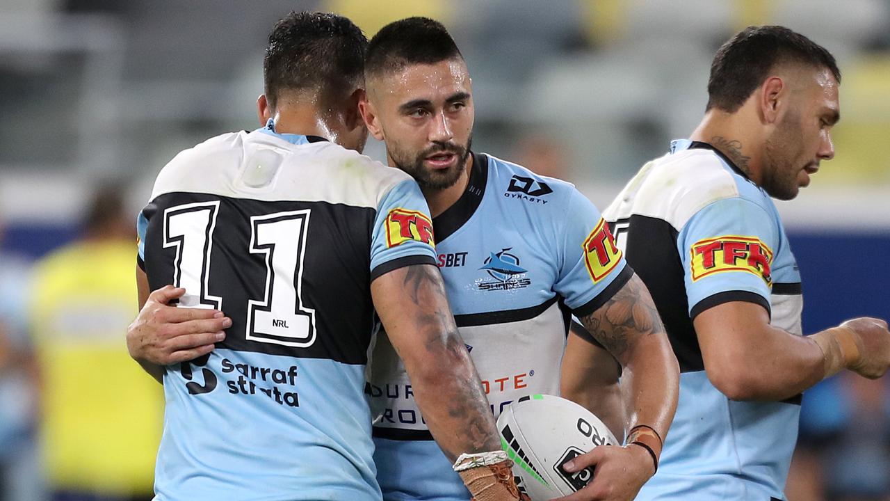 Shaun Johnson and Briton Nikora of the Sharks celebrate victory over the Cowboys.