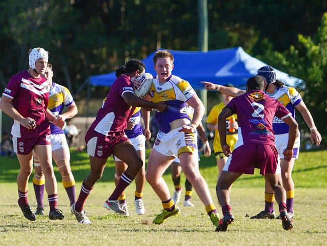 Edmonton's Corey Kennedy is tackled by Yarrabah defenders. Picture: Nuno Avendano