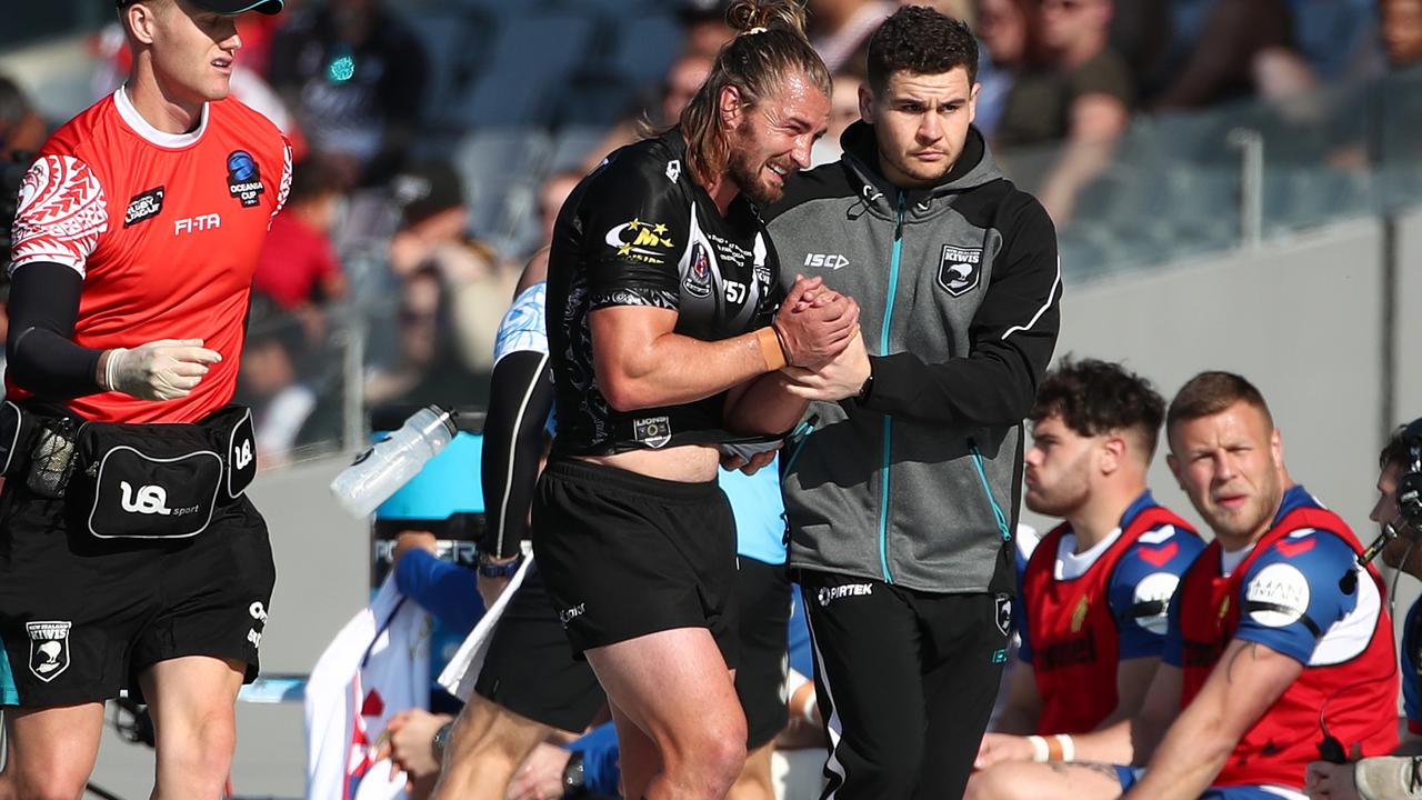 Kieran Foran leaves the field with a dislocated shoulder.