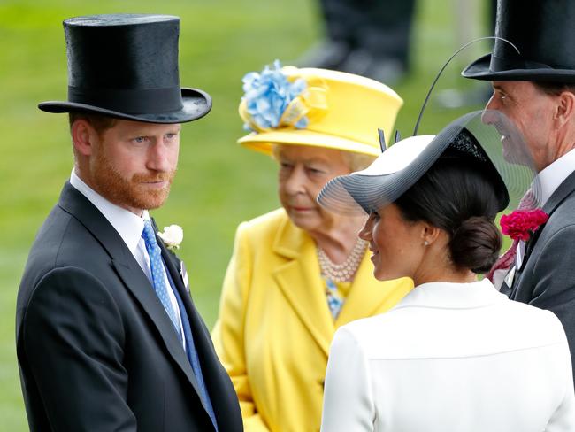 The couple with the Queen. Picture: Getty Images