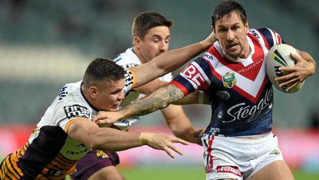 Roosters footballer Mitchell Pearce (right) decision to simulate sex with a dog at a party was caught on mobile phones and led to him being the top-searched Australian of 2016. Picture: PAUL MILLER