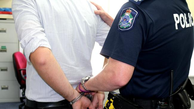 IN CUFFS: The man who allegedly broke into a Warwick home and attacked one of its residents with a knife was arrested in Killarney this afternoon. Photo Amy Lyne / Gatton Star