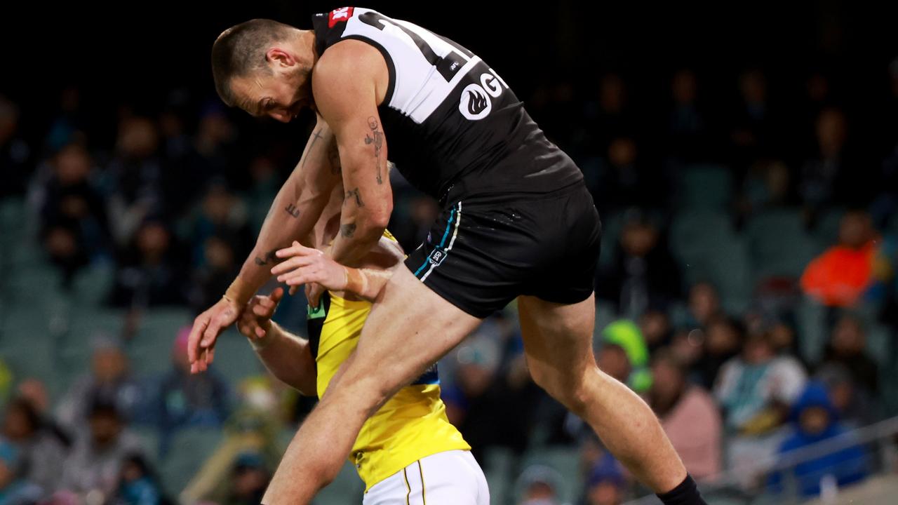 Charlie Dixon smashes into Nick Vlastuin, with the Tigers defender later leaving the field as a result of the collision. Picture: James Elsby/AFL Photos via Getty Images