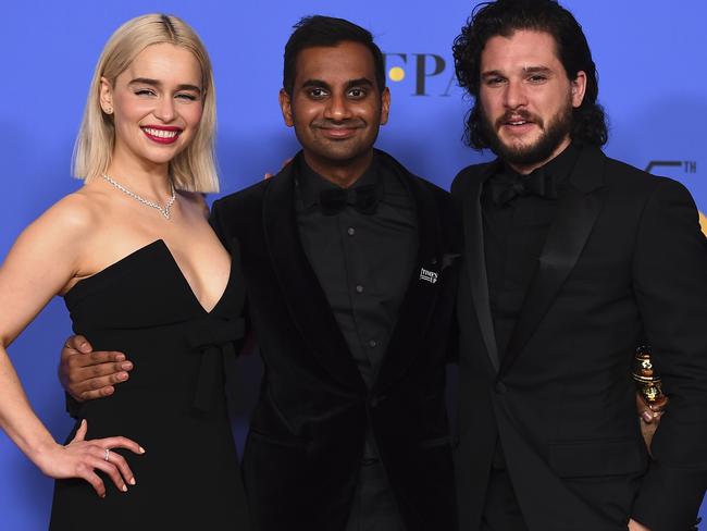 Emilia Clarke, Aziz Ansari and Kit Harington pose in the press room. Ansari was the winner of the award for best actor in a television series — musical or comedy at the Golden Globes. Photo: Jordan Strauss/Invision/AP