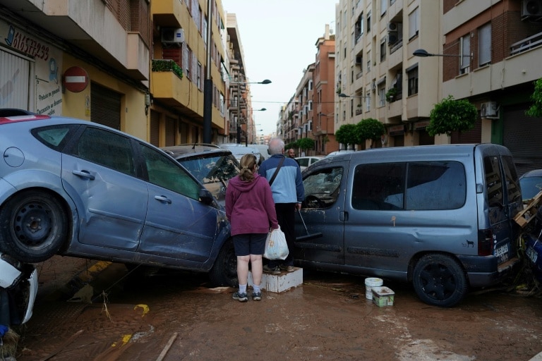 Spain urges hard-hit regions to stay home during flood rescue