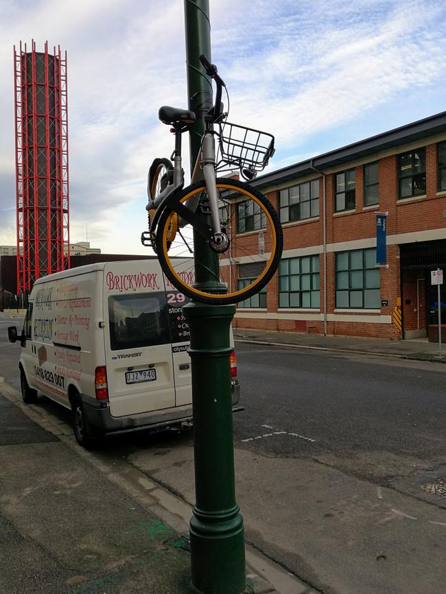 oBike taped to a lamppost on Dodds St, Southbank. Pic: Martin Sherwood