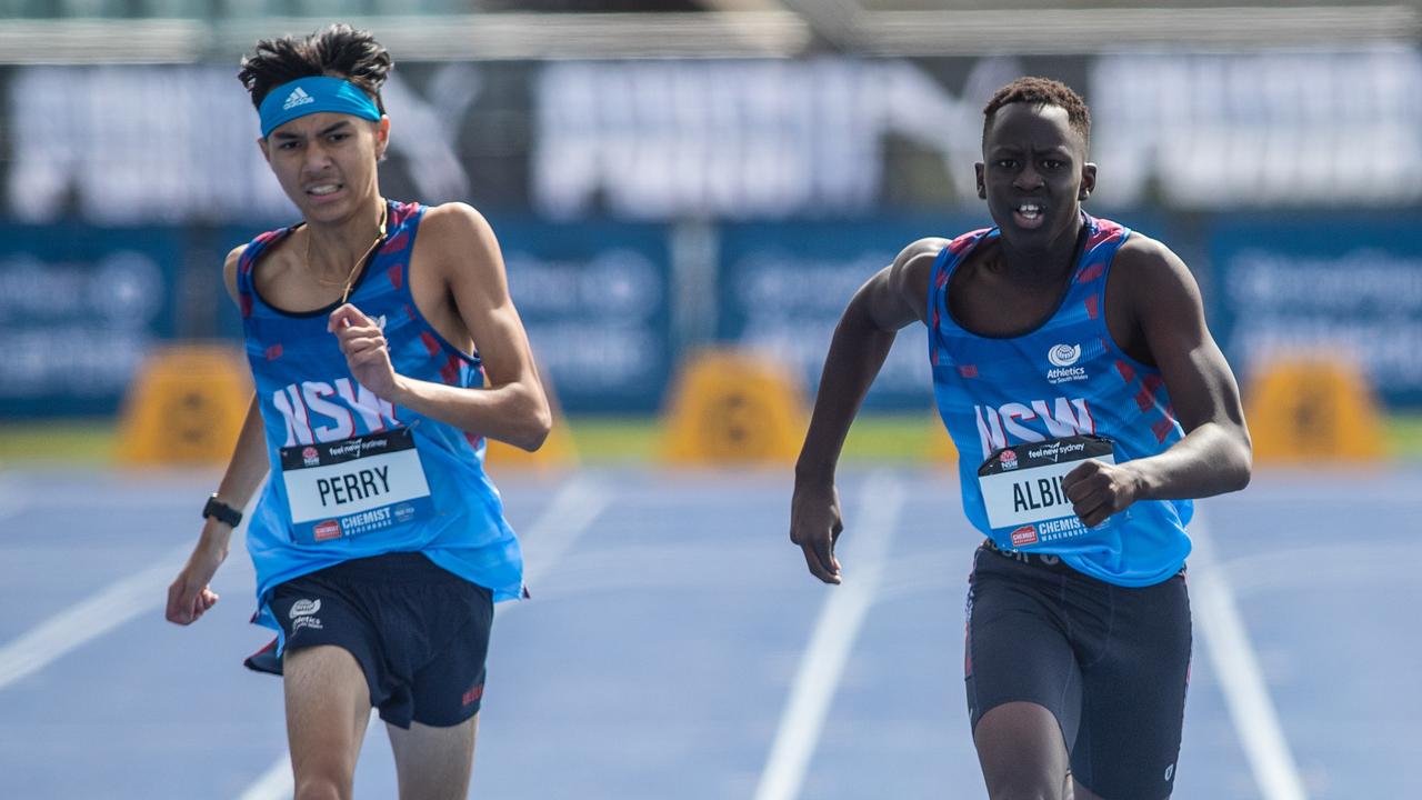 Wol Albino, right, on course for his U15 400m bronze,