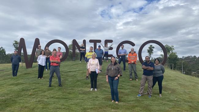 Montego Hills residents at their estate's beloved landmark.