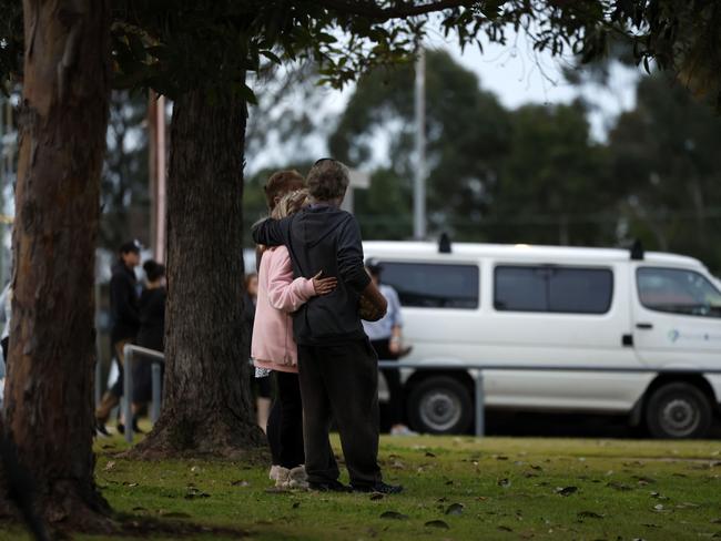 Community members gathered in Lalor Park to mourn three children killed in the recent house fire. Picture: Jonathan Ng