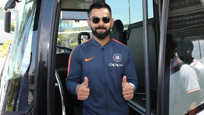 Virat Kohli gets off the bus after arriving in Australia.