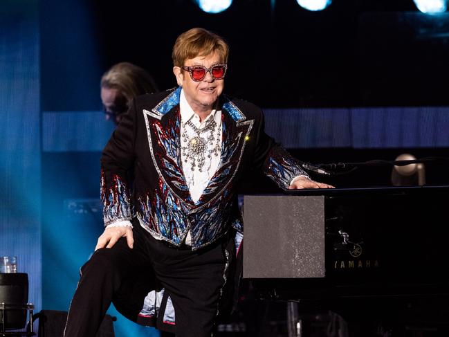 LOS ANGELES, CALIFORNIA - NOVEMBER 17: Musician Sir Elton John performs onstage during the Farewell Yellow Brick Road tour at Dodger Stadium on November 17, 2022 in Los Angeles, California. (Photo by Scott Dudelson/Getty Images)