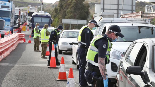 A roadblock on the Western freeway was busy bahead of restrictions easing in regional Victoria. Picture: David Crosling