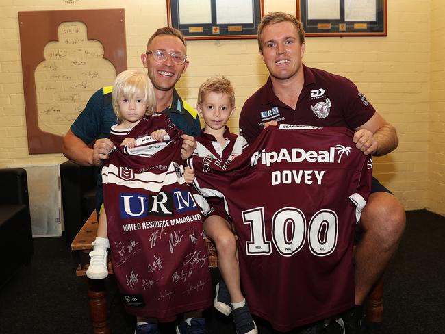 Dovey, with children Remi and Koda, is presented a Manly jersey by Jake Trbojevic for his 100th Test as team manager ahead of the third test match against New Zealand at the SCG. Picture: Brett Costello.