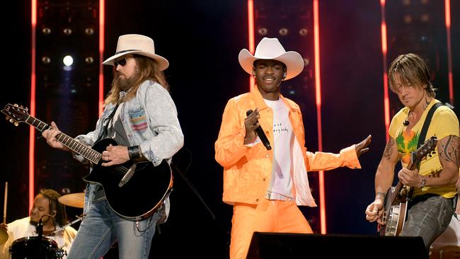 Billy Ray Cyrus, Lil Nas X and Keith Urban at the 2019 CMA Music Festival last month.