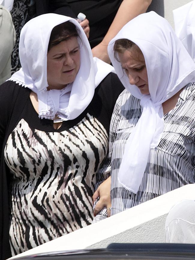 Mourners at a funeral for Lindita and Veton. Picture: Sarah Matray