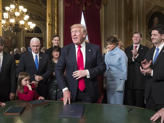 President Donald Trump is joined by the Congressional leadership and his family as he formally signs his cabinet nominations into law on January 20, 2017, in the President’s Room of the Senate on Capitol Hill in Washington. Picture: AP