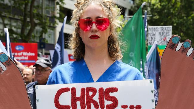 SYDNEY, AUSTRALIA : NewsWire Photos - NOVEMBER 13 2024; Nurse Grace Cahill who travelled on a bus with over 40 colleagues all the way from Wagga Wagga, gathers along with thousands of nurses and midwives who hold a 24-hour statewide strike, as they rally today. They march from Hyde Park down Elizabeth street to outside Parliament House in Sydney, with demands for fair wages, while patients across NSW will be left waiting. Picture: NewsWire / Gaye Gerard