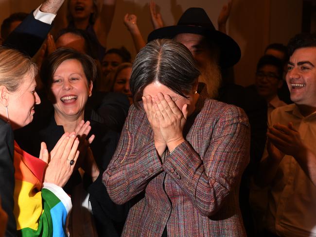Senator Penny Wong reacts as she joins Parliamentarians as they watch a live broadcast of the announcement of the results of the Marriage Equality survey in Canberra on Wednesday, November 15, 2017. Australians have given same-sex marriage their approval with a 61.6 per cent 'yes' vote in a voluntary survey. (AAP Image/Dean Lewins) NO ARCHIVING