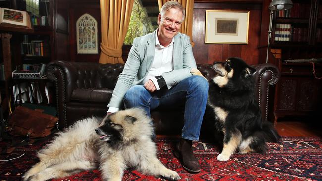 Andrew Bolt at home with dogs Kees, left, and Ralf: ‘I do feel passionately’. Picture:  Aaron Francis