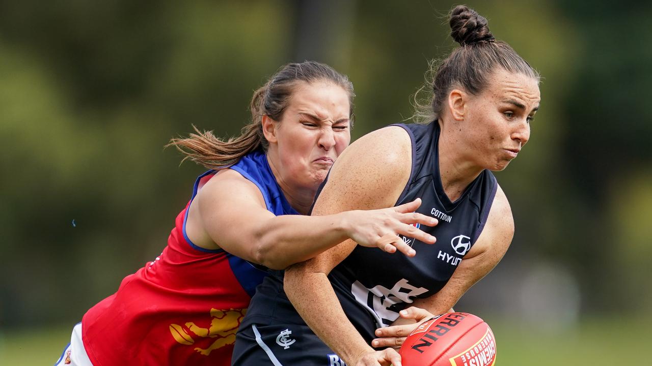 Lauren Brazzale of the Blues is tackled by Breanna Koenen of the Lions. Picture: Natasha Morello