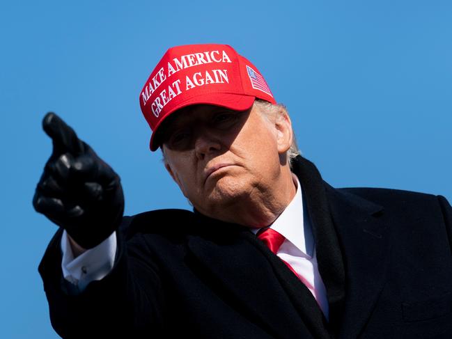 TOPSHOT - US President Donald Trump leaves after speaking during a Make America Great Again rally at Fayetteville Regional Airport November 2, 2020, in Fayetteville, North Carolina. - The US presidential campaign enters its final day Monday with a last-minute scramble for votes by Donald Trump and Joe Biden, drawing to a close an extraordinary race that has put a pandemic-stricken country on edge. (Photo by Brendan Smialowski / AFP)