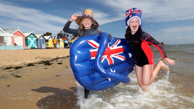 Scarlett Ettershank, 9 and Jess Brown, 11, celebrate at Brighton Beach in Melbourne. Picture: David Geraghty