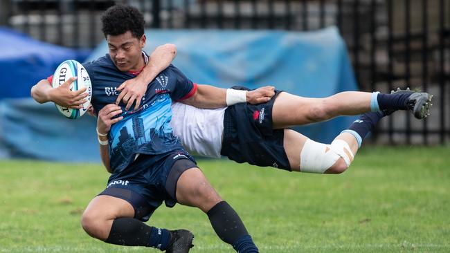 Rebels PJ Palu scoring despite the best efforts of NSW’s Jack Matthews.