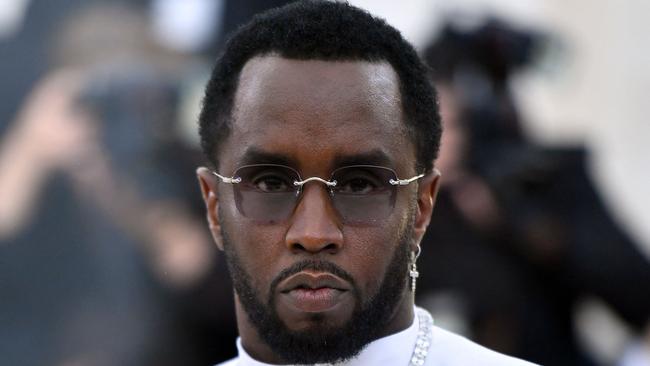 (FILES) Sean Combs 'P. Diddy' arrives for the 2018 Met Gala on May 7, 2018, at the Metropolitan Museum of Art in New York. Music mogul Sean Combs is set to go on trial for racketeering and sex trafficking on May 5, 2025, a judge said in a court hearing October 10, 2024. The rapper known as "Diddy" will remain incarcerated, said federal judge Arun Subramanian, after he was indicted last month on three criminal counts that allege he sexually abused women and coerced them into drug-fueled sex parties using threats and violence. (Photo by ANGELA WEISS / AFP)