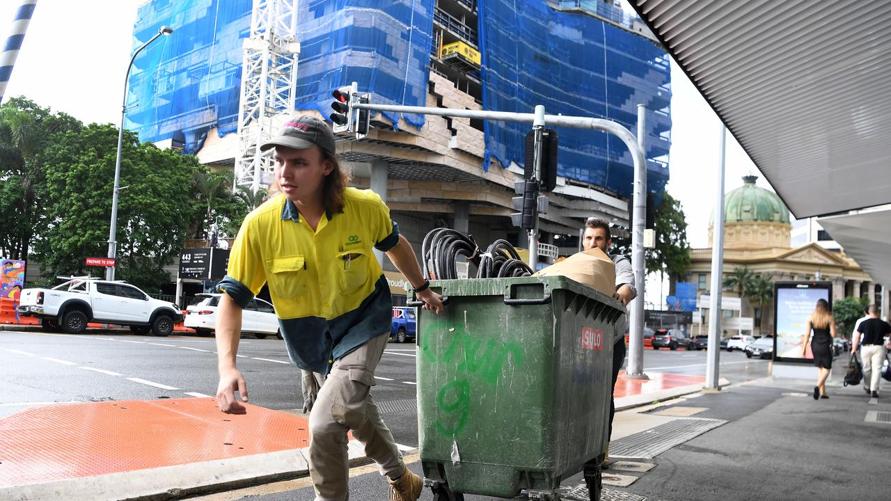 Workers leaving a Probuild construction site.