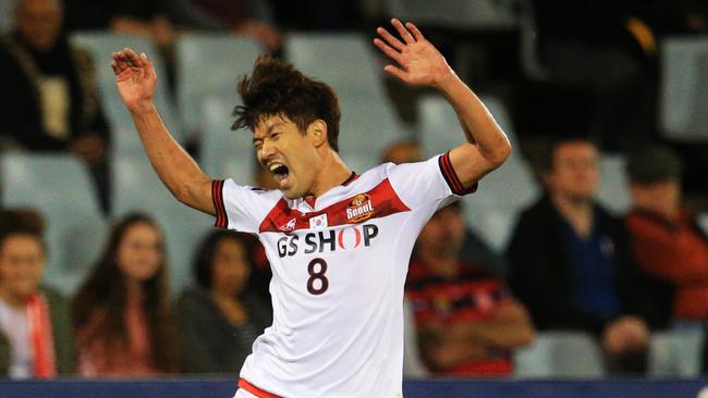 Shannon Cole of the Wanderers tackles Sang-ho Lee of FC Seoul  during the Western Sydney Wanderers v FC Seoul Asian Champions League match at Campbelltown Stadium. pic Mark Evans