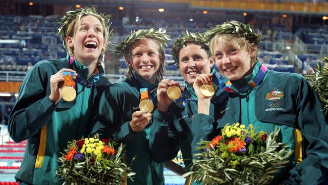 Jodie Henry (left) won the 100m freestyle, the 4×100-metre medley relay and the 4x100 freestyle relay alongside Libby Lenton, Petria Thomas and Alice Mills.