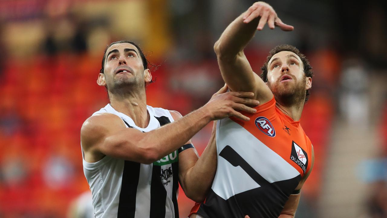 Brodie Grundy and Shane Mumford in a ruck contest.