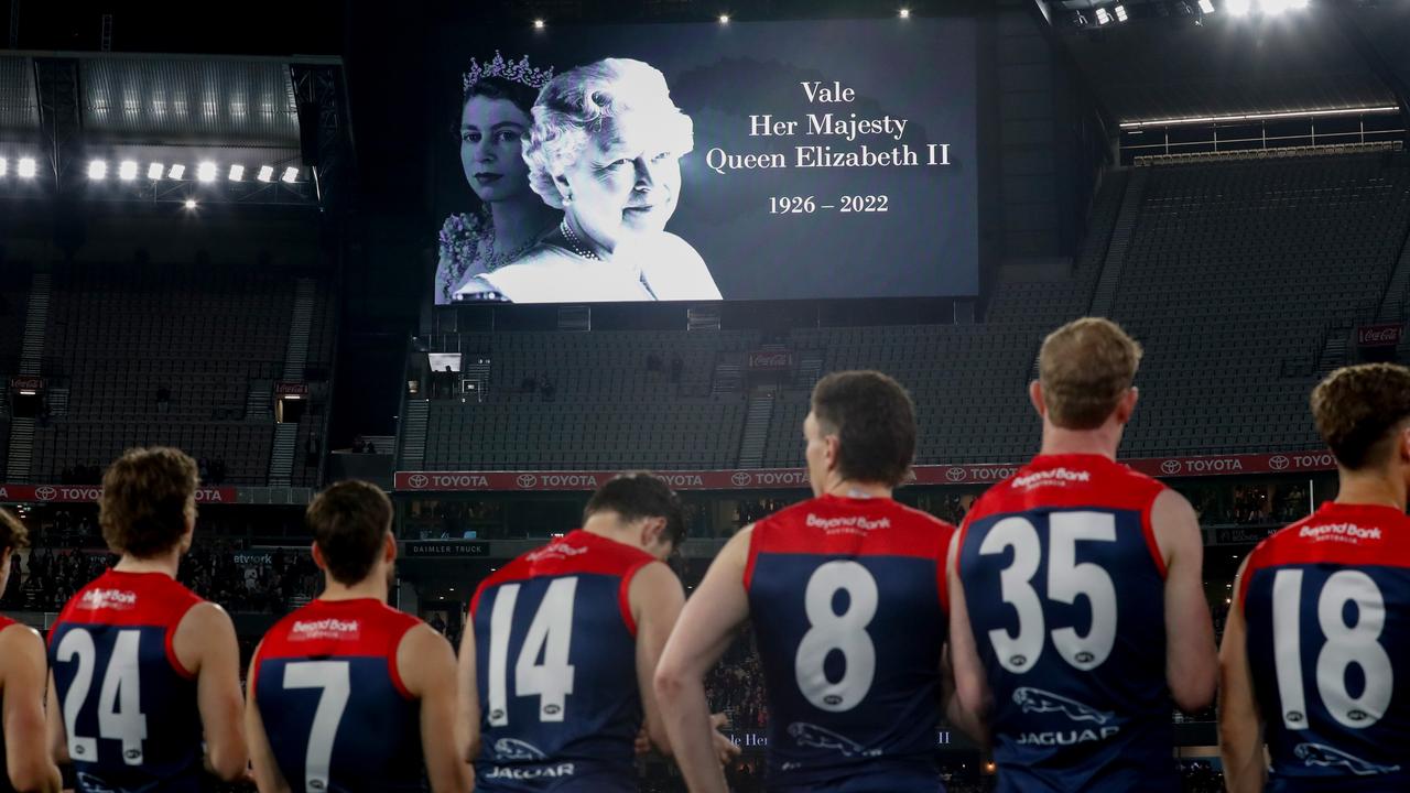 Players observe a minute’s silence in memory of Her Majesty Queen Elizabeth II. Photo by Michael Willson/AFL Photos via Getty Images