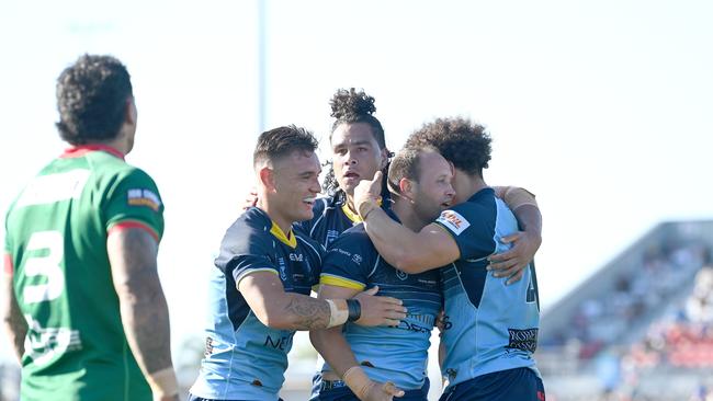 BRISBANE, AUSTRALIA - OCTOBER 10: Tyrone Roberts of the Devils is congratulated by team mates after scoring a try during the 2021 QRL Intrust Super Cup Grand Final match between the Norths Devils and the Wynnum-Manly Seagulls at Moreton Daily Stadium on October 10, 2021, in Brisbane, Australia. (Photo by Bradley Kanaris/Getty Images)