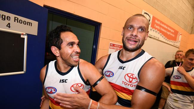 Eddie Betts (left) and teammate Cam Ellis-Yolmen of the Crows celebrate winning the Round 11 AFL match between the Melbourne Demons and the Adelaide Crows at TIO Stadium in Darwin, Saturday, June 1, 2019. (AAP Image/Dan Peled) NO ARCHIVING, EDITORIAL USE ONLY