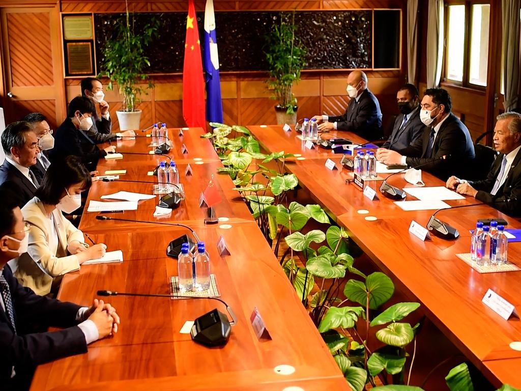 Wang Yi meets with Henry Puna of the Pacific Islands Forum. Picture: AFP