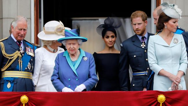 Prince Charles, Camilla, Duchess of Cornwall, Queen Elizabeth II, Meghan, Duchess of Sussex, Prince Harry, Duke of Sussex, Prince William, Duke of Cambridge, and Catherine, Duchess of Cambridge, on the balcony of Buckingham Palace.