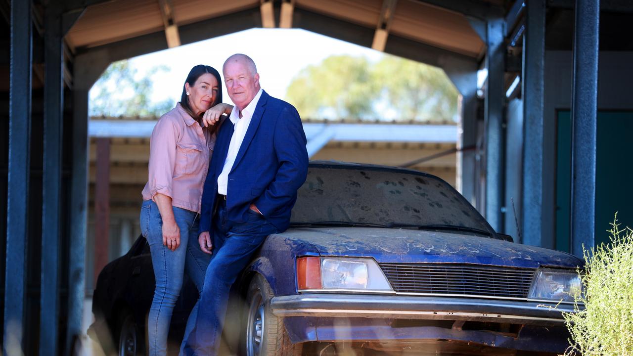 Ex detective and cold case specialist Damian Loone and Rachelle Childs sister Kristy stand with Rachelle's Commodore. Picture: Jeff Darmanin