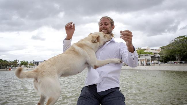 Wynnum man known as Ty Clint poses for a photograph with his dog Sadie on the Wynnum foreshore. Picture: AAP/Sarah Marshall