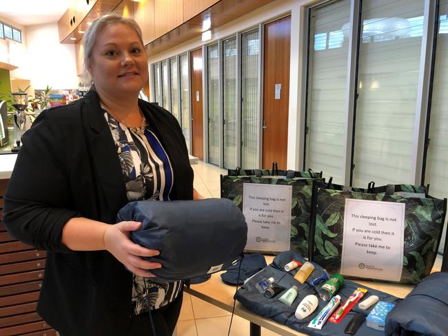 HELPING HAND: Hervey Bay Neighbourhood Centre chief executive Tanya Stevenson with one of the sleeping bags and the included items which are given out to homeless people.