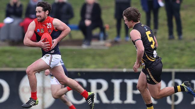 Action from round 2 of the TSL between the Tigers v North Hobart from Kingston Twin Ovals. North Hobart's Troy Cunliffe bursts clear of Lachie Clifford. Picture: Zak Simmonds