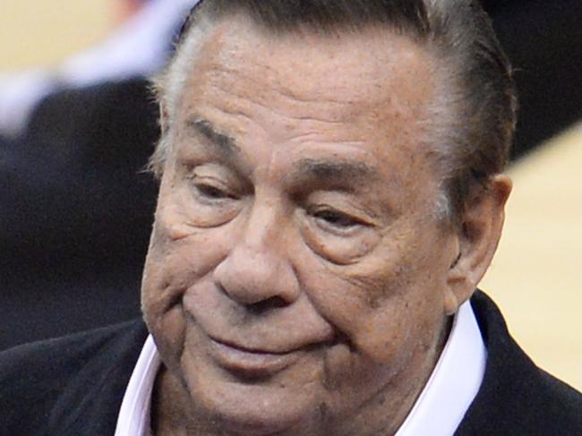 (FILES): This April 21, 2014 file photo shows Los Angeles Clippers owner Donald Sterling attending the NBA playoff game between the Clippers and the Golden State Warriors at Staples Center in Los Angeles, California. Two weeks after the NBA banned Sterling from all league activities, fined him USD2.5 million and began proceedings to strip him of his team, the 80-year-old real estate billionaire insisted he's not a racist. "I'm not a racist," Sterling told CNN's Anderson Cooper in an interview due to air May 12, 2012. "I made a terrible mistake. I'm here to apologize." AFP PHOTO / Files / ROBYN BECK